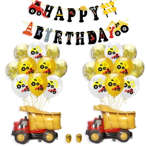 Close-up of Happy Birthday banner with construction vehicles and dump truck balloons