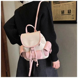 Detail of the vintage contrast leather backpack with drawstring and magnetic flap