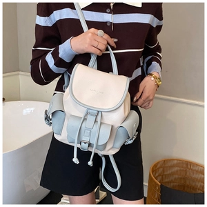 Close-up of contrast color backpack with lychee pattern PU leather and drawstring