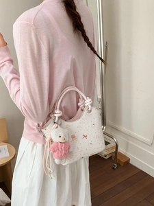 Floral print crossbody bucket bag with round handle and plush bear charm for women