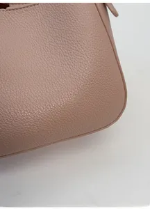 Detail of soft nude pink litchi grain leather showing high quality texture and shape