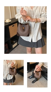 Close-up of brown bucket bag featuring lychee texture leather and golden turn-lock