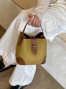 Fashionable ginger and brown two-tone bucket bag with gold lock for daily commuting