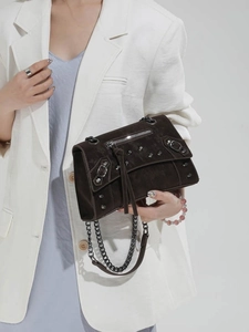 Dark brown suede motorcycle bag with silver rivets and metal chain strap for women