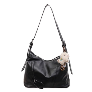 Sac à main minimaliste en similicuir noir avec bandoulière large et porte-clés mouton blanc