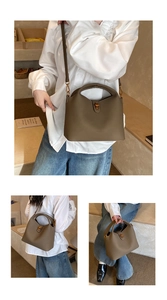 Litchi pattern leather bucket bag details with gold hardware and removable shoulder strap