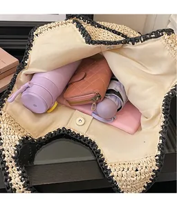 Top view of spacious straw tote bag interior with magnetic closure and daily essentials