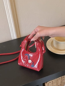 Red quilted mini crossbody bag with horse embroidery and stylish top handle design