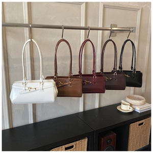 Row of retro french leather underarm bags in white brown burgundy coffee and black colors