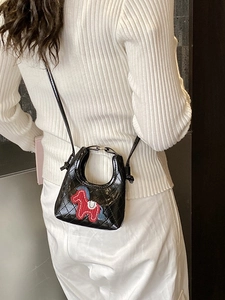 Black quilted mini crossbody bag with horse embroidery and silver ring handle