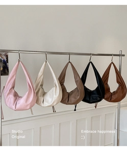 Detailed display of five color options for the large pleated crescent shoulder bag