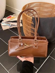 Vintage brown patent leather rectangular handbag with gold hook and long handles
