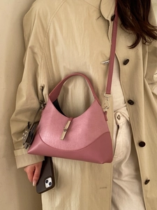 Fashionable color-block bucket bag in dusty rose pink with metallic silver buckle