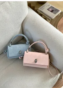 Chic Morandi tone crossbody bags with knotted handle and elegant metal twist lock detail