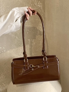 Vintage dark brown glossy leather shoulder bag with elegant gold hardware and thin handle