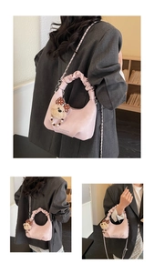 Pink crescent cloud bag with pleated handle and cute bear charm shown in various angles