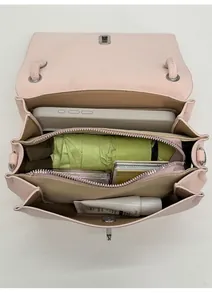 Overhead view showing organized interior compartments of the pink leather handbag