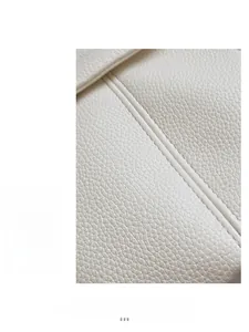 Macro shot of white lychee grain leather handbag with professional double stitching detail