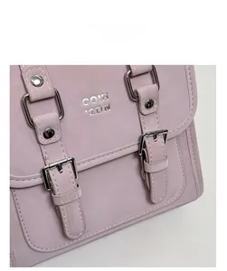 Detail view of the lavender faux leather bag showing silver buckles and COIH 2DN logo