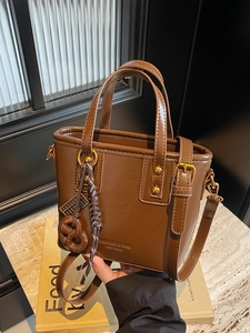 Vintage brown PU leather bucket bag with top handles and adjustable shoulder strap