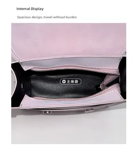 Top view of the pink square handbag interior showing spacious main compartment and zipper