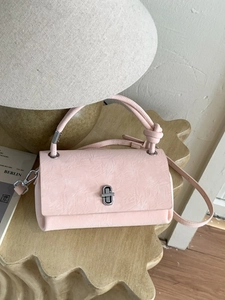 Pink pleated texture rectangular handbag with silver rotary lock and top handle