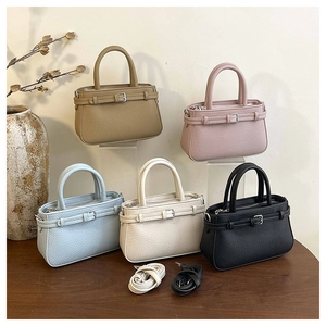 Detailed group view of five colorful mini pebble leather tote bags with adjustable straps