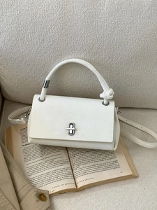 White textured leather square handbag with woven handle and silver metal rotating lock