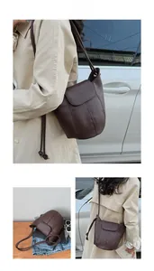 Detailed views of dark brown litchi texture bucket bag shown with beige trench coat