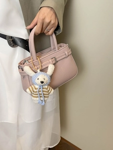 Pink lychee texture handbag with silver buckle and cute knitted rabbit charm