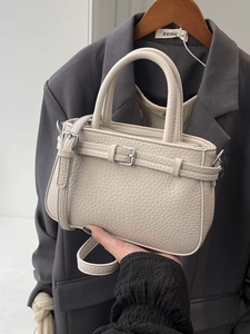 Chic beige lychee leather tote bag with silver buckle for elegant office commuting