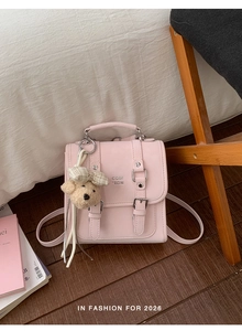 Pink PU leather mini backpack with buckled flap and cute plush bear keychain