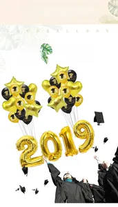 Macro detail of 2019 gold foil and printed latex balloons for graduation party decor