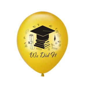 Close-up of a yellow graduation balloon with We Did It text and academic icons