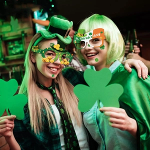 St. Patrick's Day party set featuring green shamrock glasses, hats and festive accessories
