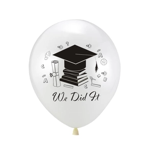 White graduation latex balloon with We Did It text and hand-drawn academic motifs