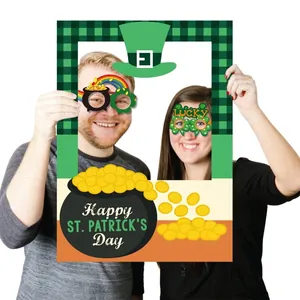 St. Patrick's Day photo booth props set including green clover glasses and a festive frame