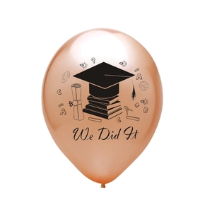 Detail of rose gold graduation balloon with black We Did It print and icons