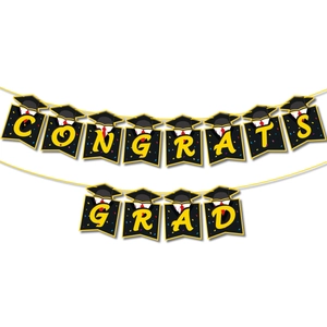 Close-up of CONGRATS GRAD graduation banner with black cardstock and yellow letters