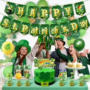 St. Patrick's Day party decorations with banner balloons and shamrock cake toppers