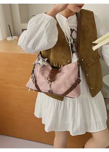 Side view of vintage patchwork shoulder bag with star charm and tassel detail
