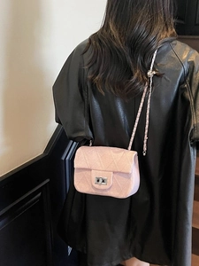 Pink quilted crossbody bag with silver chain strap and sparkling texture for women