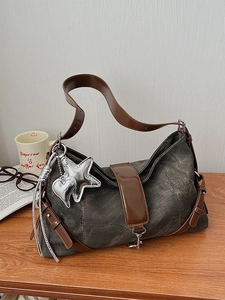 Retro denim underarm bag in dark grey with star charms and brown leather straps