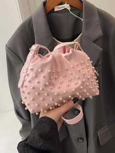 Chic pink bucket bag with pearls and drawstring, elegant crossbody for women fashion