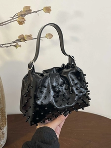 Chic black patent leather handbag with bead embellishments and silver hardware handle