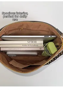 Macro shot showing large capacity interior with zipper pocket and device storage