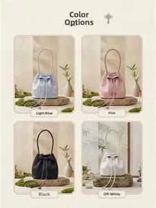 Detail showing four color options of jacquard bucket bags with drawstring and bow detail