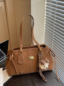 Brown suede underarm tote bag with metal plaque and cute bear charm pendant