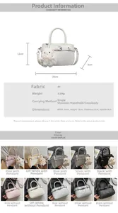 Detail view of stylish mini tote bag with pearl rabbit charm and detachable shoulder strap