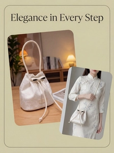 Detail of white satin bucket bag with floral embroidery and elegant bow drawstring closure